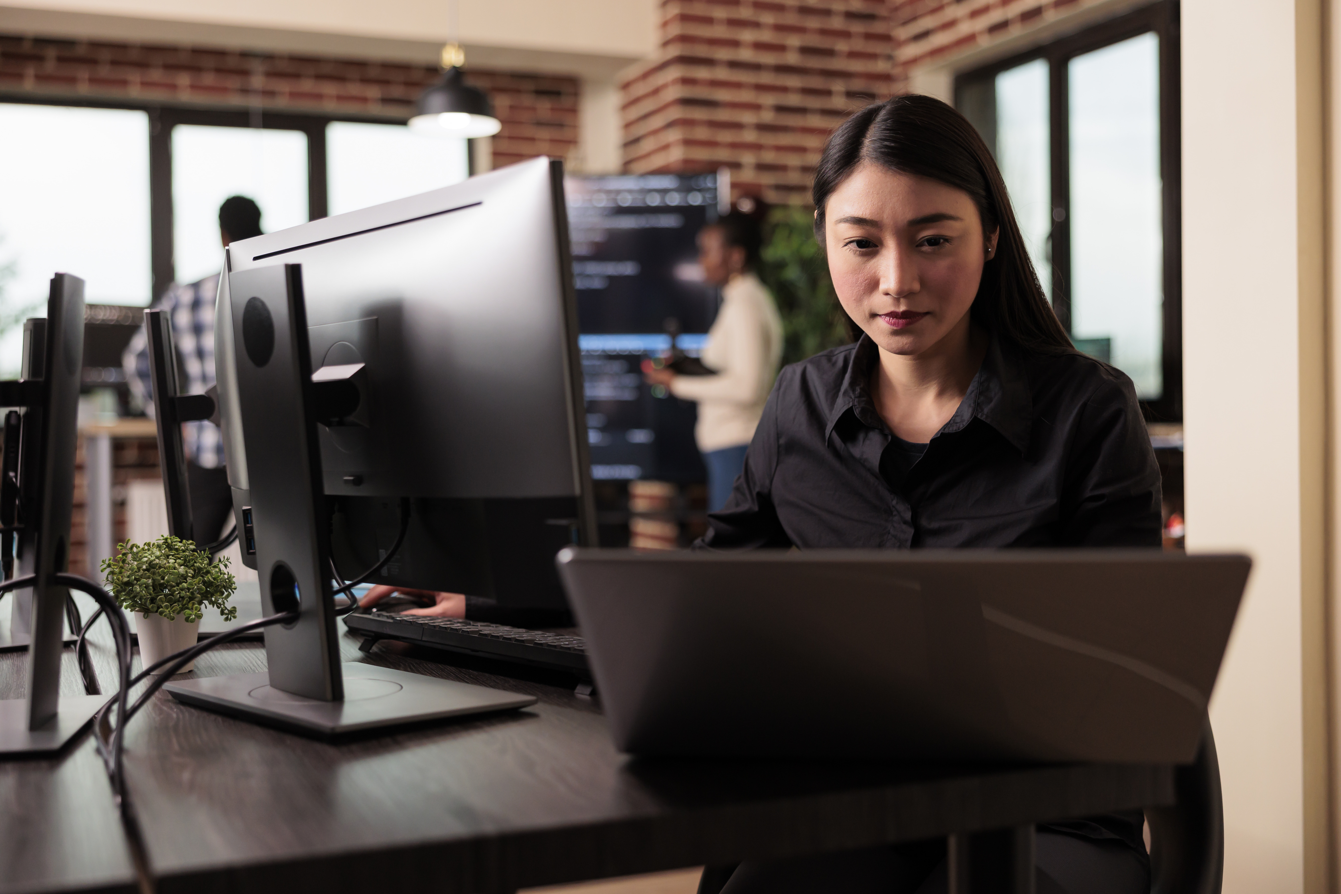 freelance-coder-typing-machine-learning-server-code-sitting-desk-table-it-software-company-software-developer-working-database-system-with-coding-script-it-developing-office (1).jpg